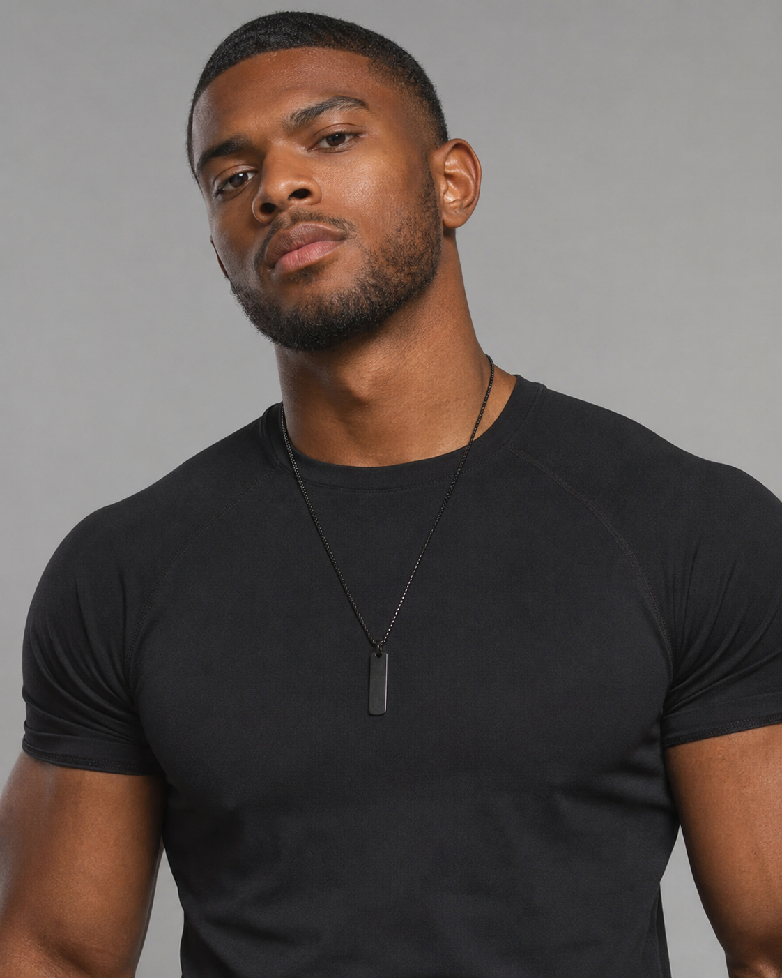 Male model wearing the Black Building Block pendant
