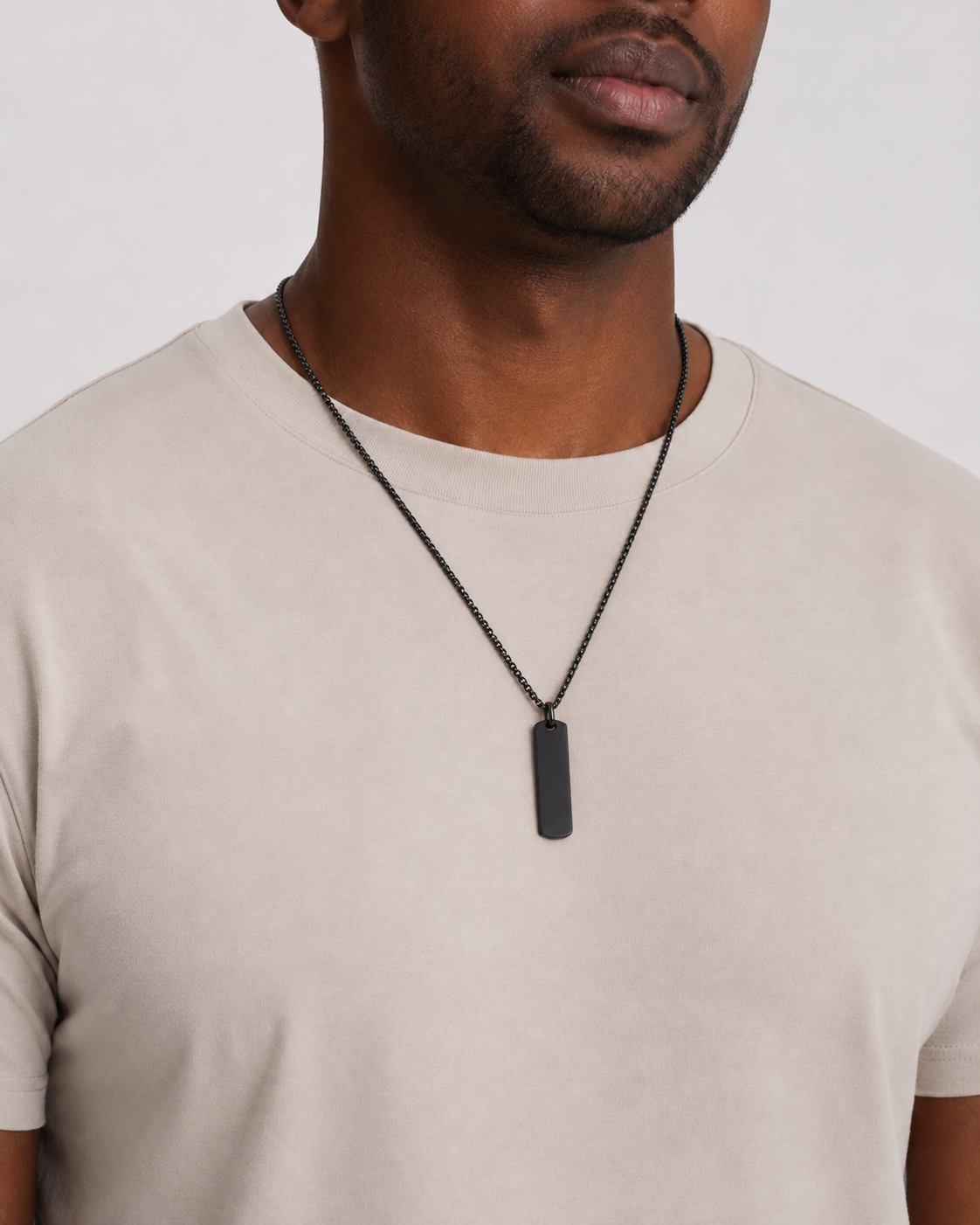 Model wearing the Black Building Block pendant